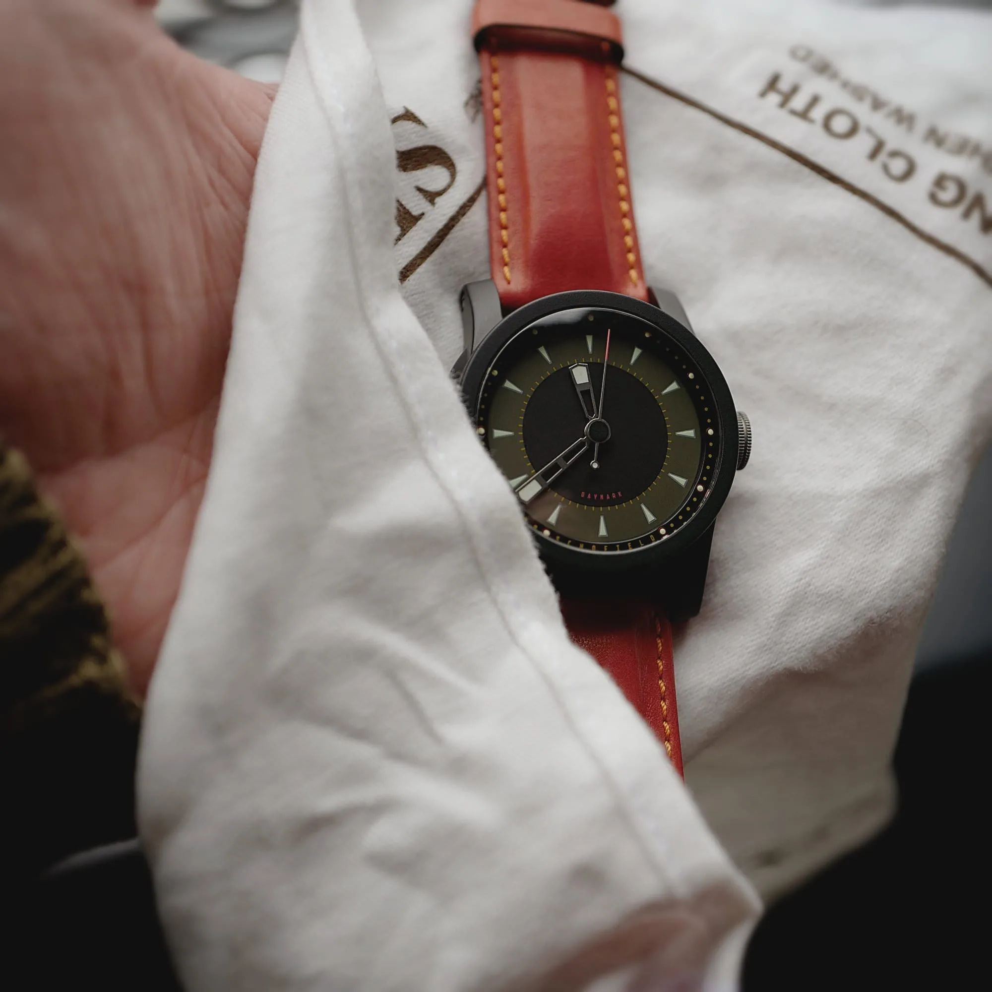 Daymark Dark on tomato red Schofield and Cudd strap