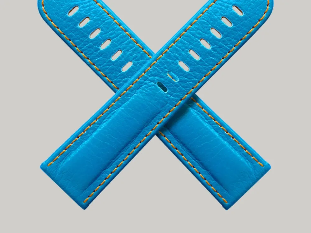 Two bright neon straps in a day-glow blue with orange stitching. High quality leather made by Schofield.