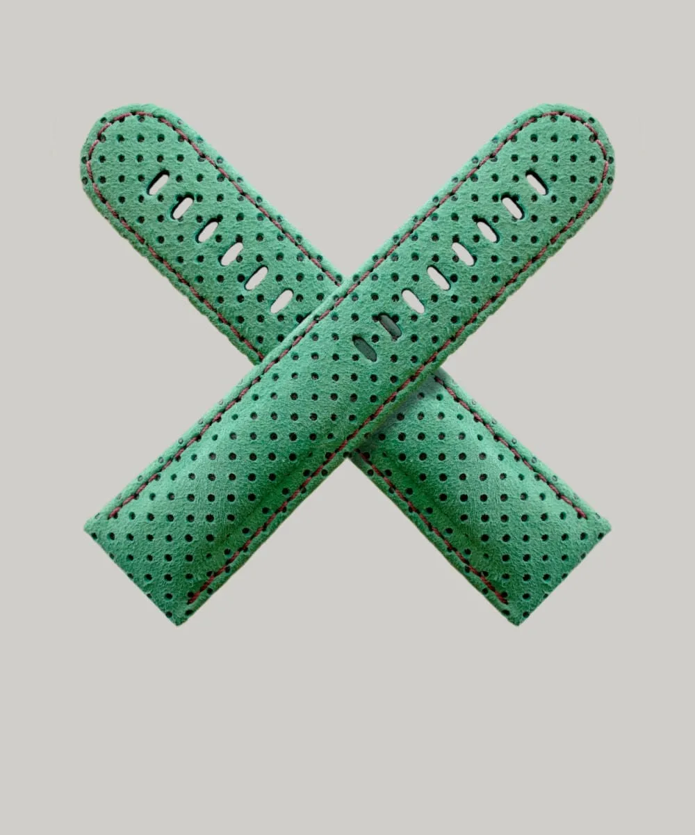 Green Perforated watch straps, Made of suede. The straps feature multiple holes for adjustment and red-brown stitching along the edges.
