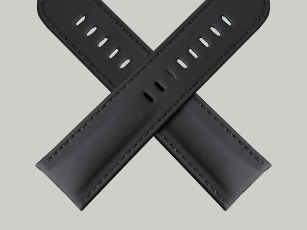 A pair of black India Rubber watch straps. The straps have multiple holes for adjusting the fit The sticking is black.