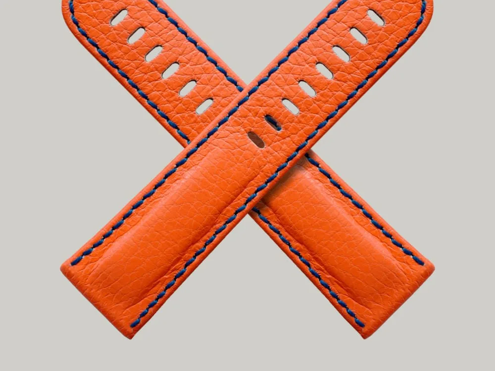 Super bright orange Neon watch straps by Schofield. A British leather with a subtle texture. A navy blue stitching around the edge.