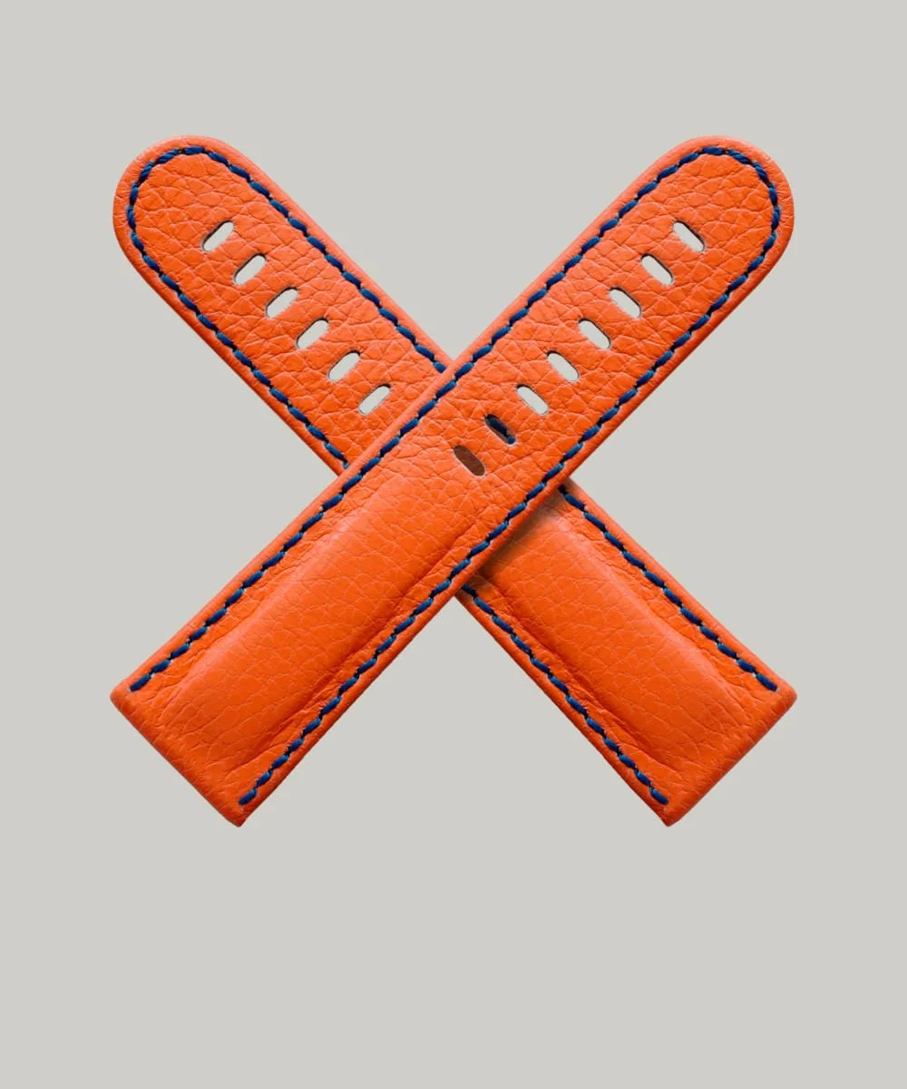 Super bright orange Neon watch straps by Schofield. A British leather with a subtle texture. A navy blue stitching around the edge.