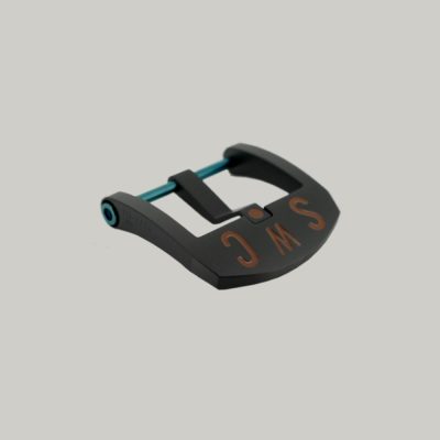 A Black DLC BE Buckle with a blue PVD strap fitting screw. The thumbnail style buckle, called The Best Ever Buckle, features the engraved letters "SWC" in a red paint fill.