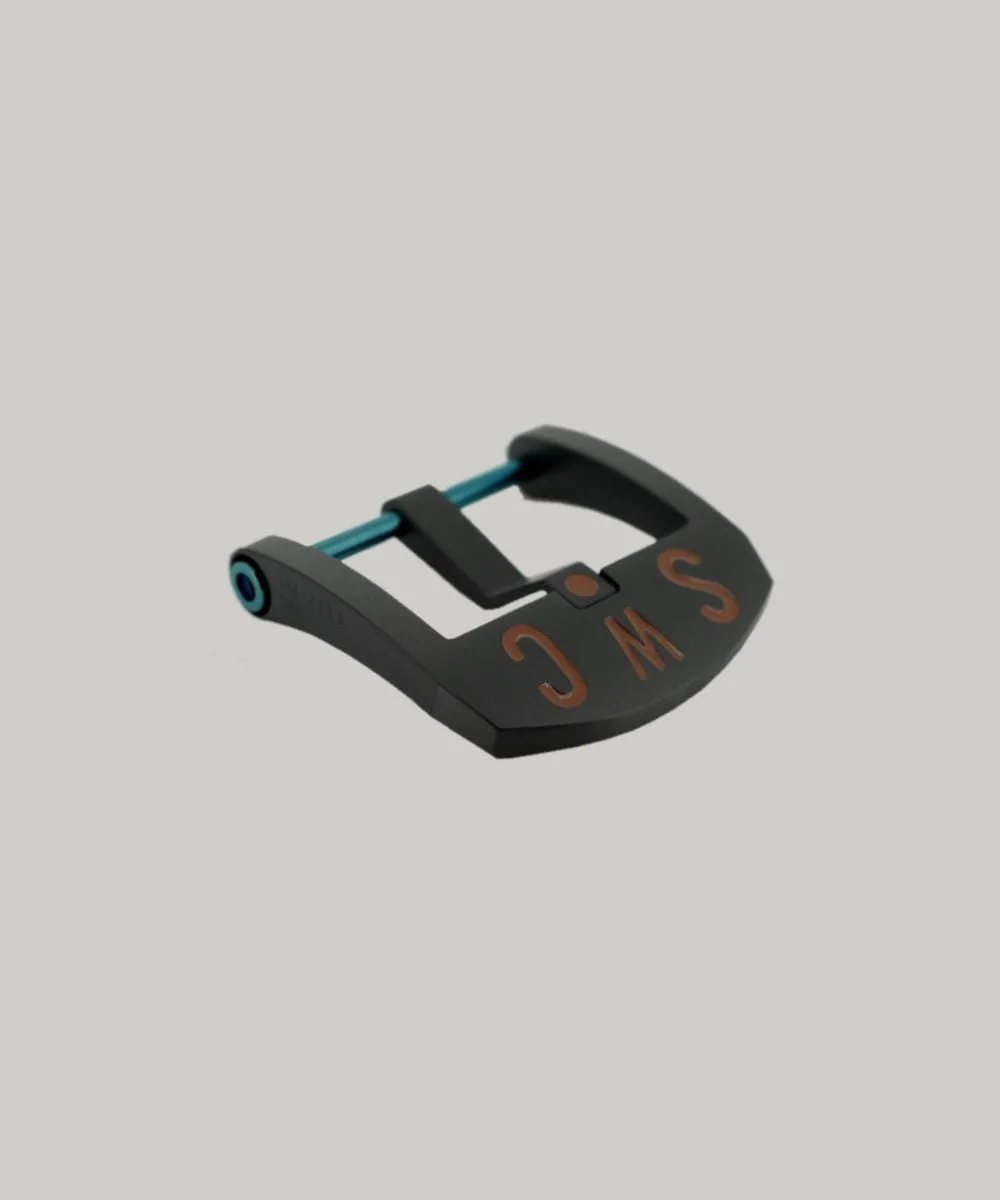 A Black DLC BE Buckle with a blue PVD strap fitting screw. The thumbnail style buckle, called The Best Ever Buckle, features the engraved letters "SWC" in a red paint fill.