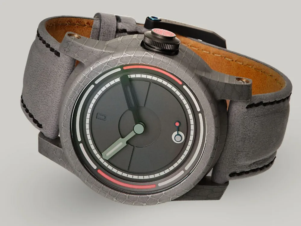 The British made, unique designed, minimal Obscura watch lying on its side showing the Damascus steel case and lume crown.