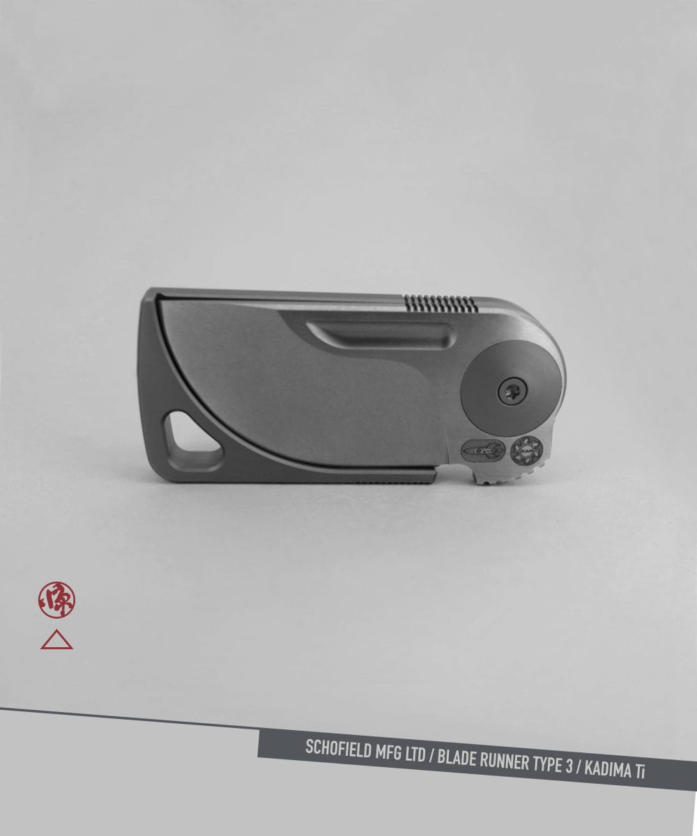 Blade Runner Type 3 A sleek, modern folding knife with a minimalist design is shown closed against a gray background. The text at the bottom reads "SCHOFIELD MFG LTD / BLADE RUNNER TYPE 3 / KADIMA Ti.