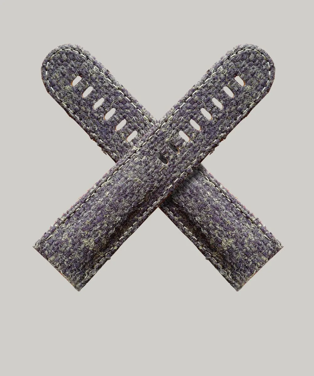 A watch strap made with a help wool mix in brown and purple - like heather.