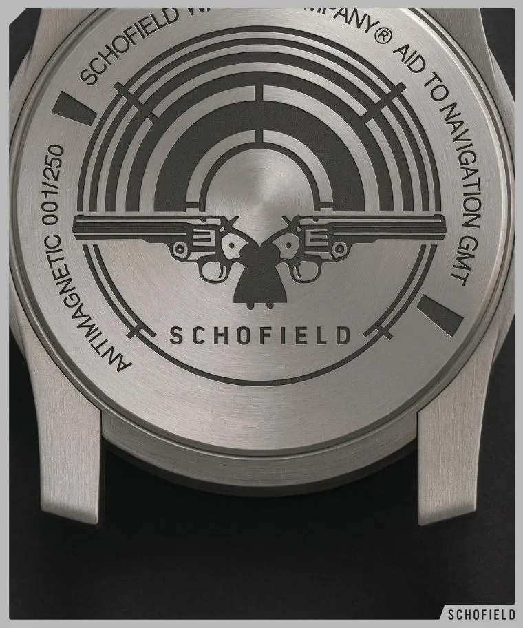 A steel watch case back showing Schofield Watch Company and two Schofield model revolvers engraved