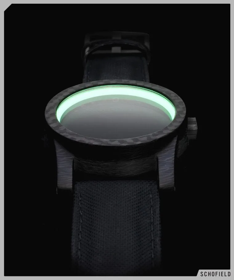 A Schofield carbon fibre watch called the Blacklamp with Moonglow ring