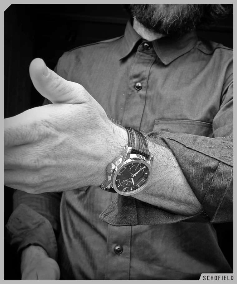 Man in work-shirt wearing a polished Schofield Signalman