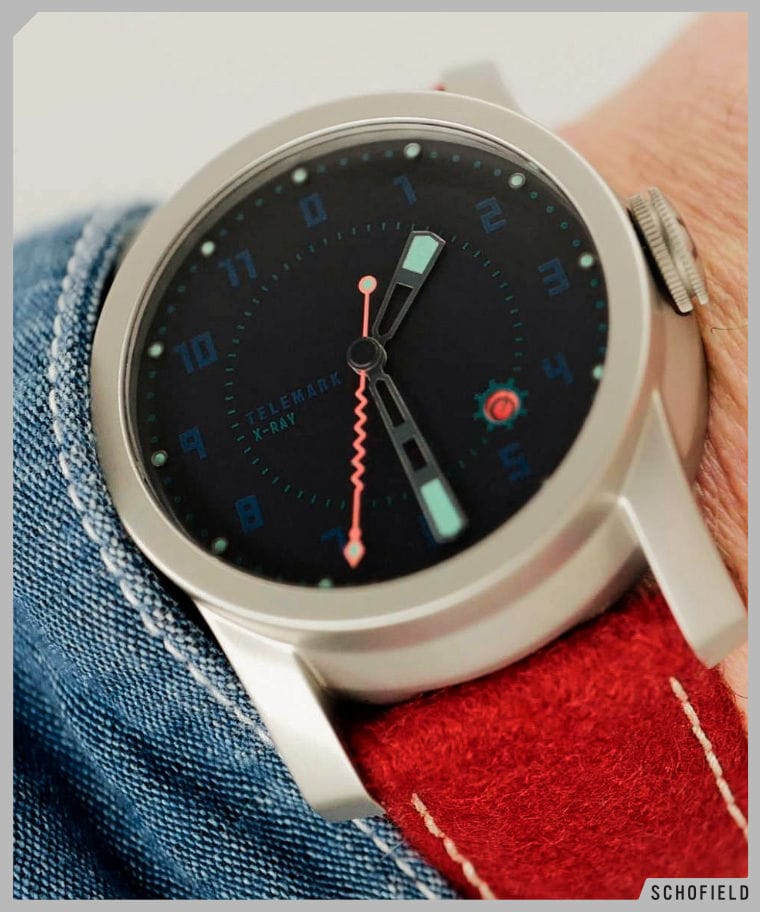 The Telemark X-ray watch on wrist. Very dark blue dial and zigzag orange seconds hand