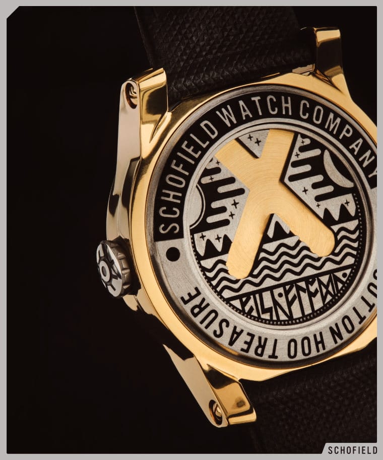 Case back of Schofield's gold plated watch with elaborate x design