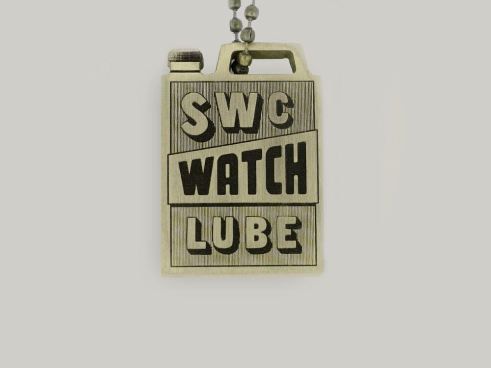 Brass key ring by Schofield Watch Company, like an old-fashioned oil can A brass key ring in the shape of an oil can with SWC watch lube written on it