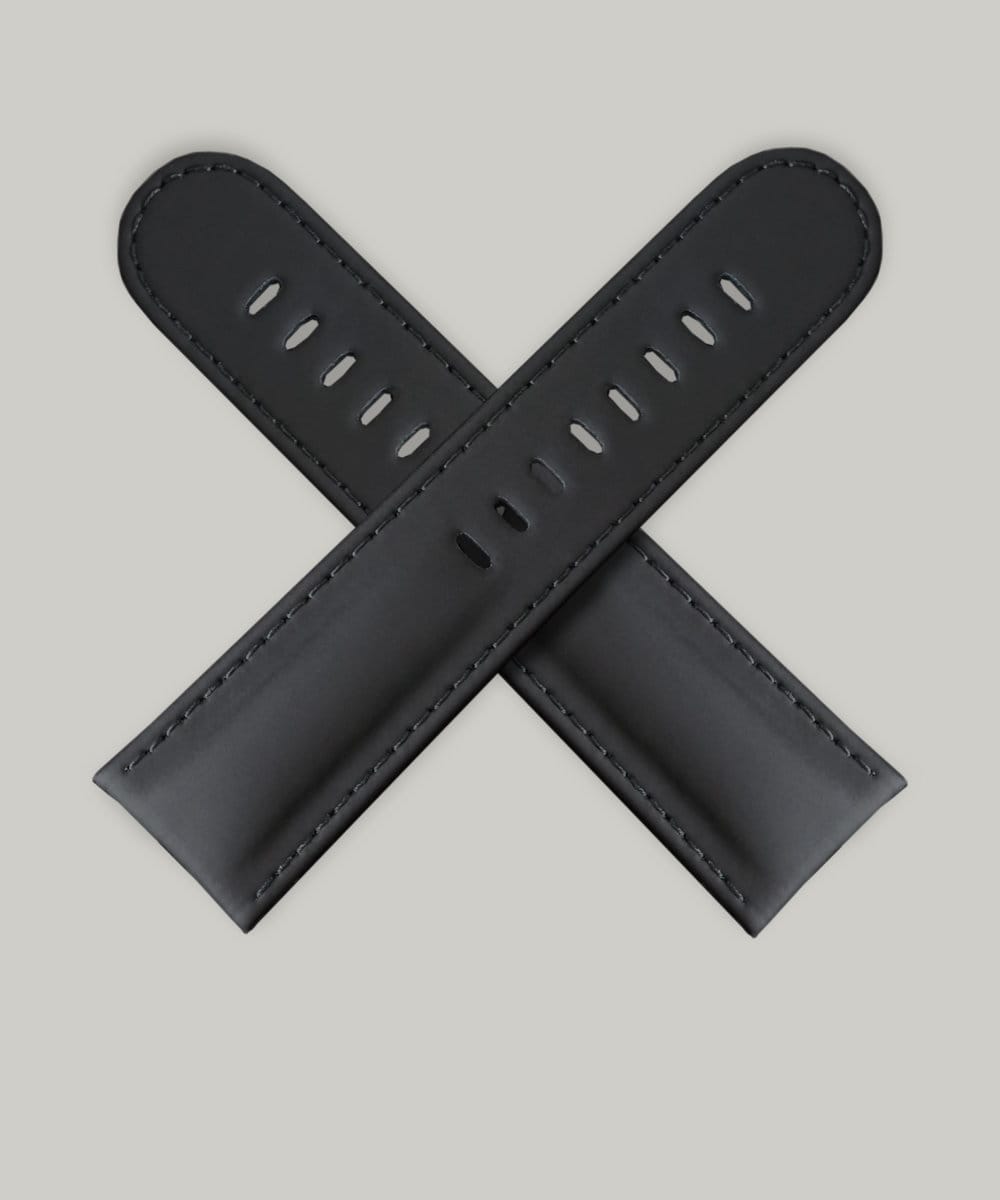 A pair of black India Rubber watch straps. The straps have multiple holes for adjusting the fit The sticking is black.