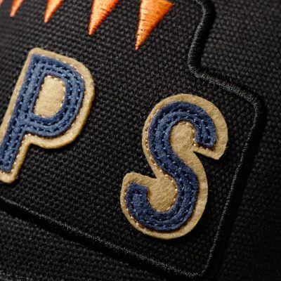 A close up of some letters applied to the front of the Black 6 Pips cap