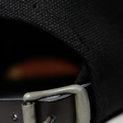 Close up of the black leather adjustment and buckle