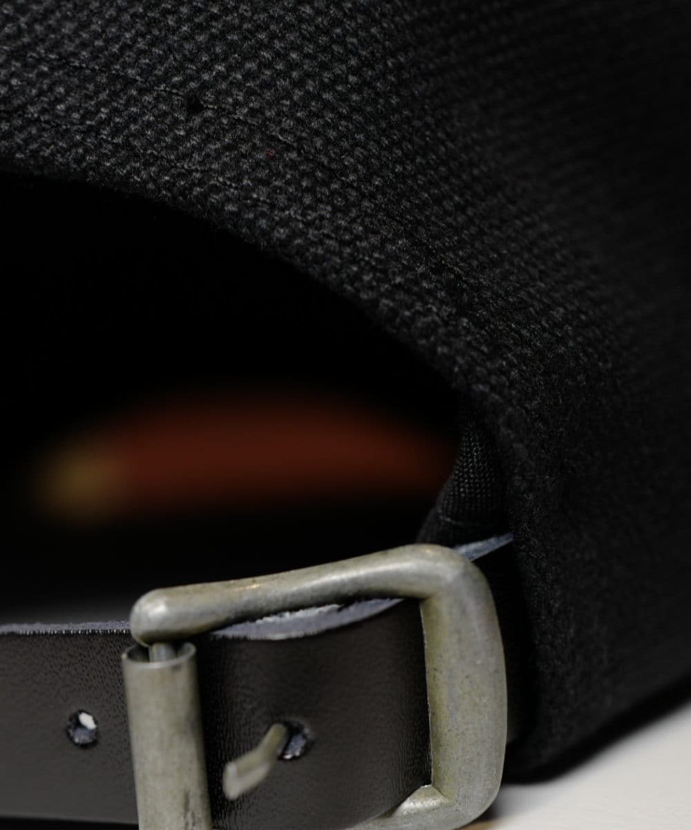 Close up of the black leather adjustment and buckle