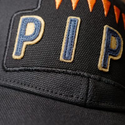 The patch applied to the black canvas cap
