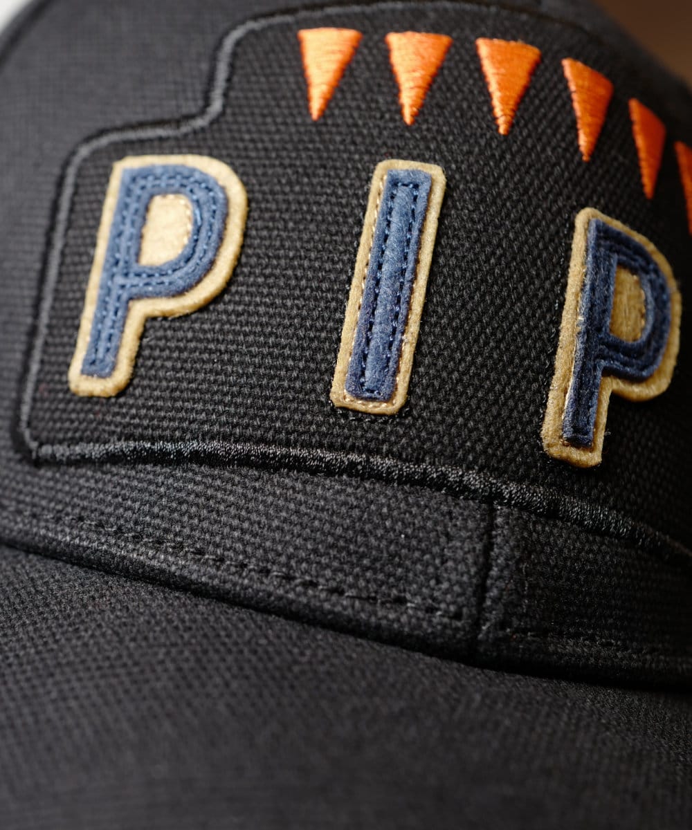 The patch applied to the black canvas cap