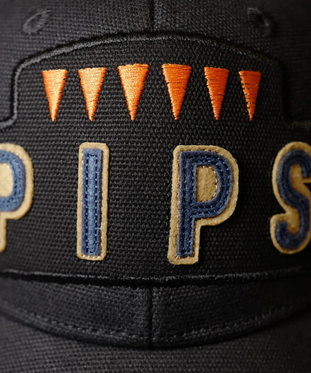 Close up of the orange teeth that count the 6 Pips