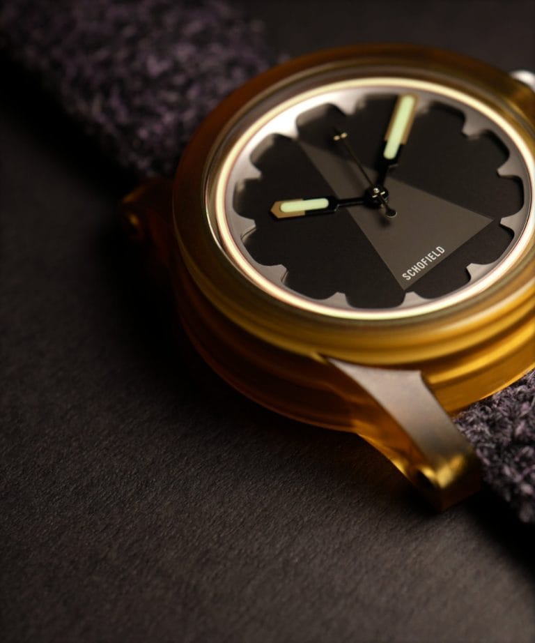 Skeptiko Ultem watch - specialist composition materials used in watchmaking. An orange cased watch with grey dial