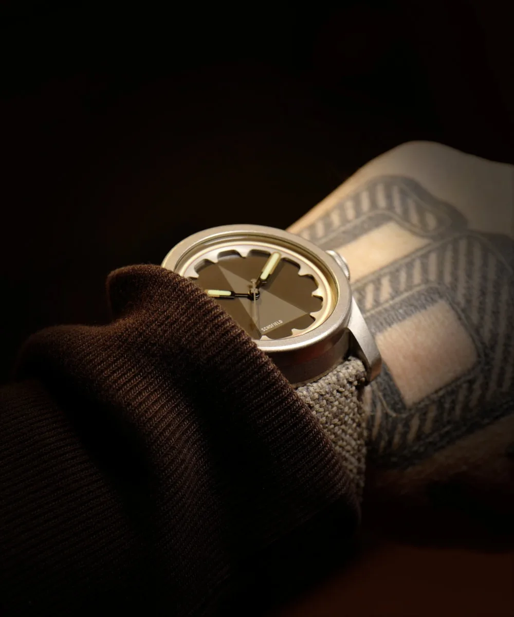 Schofield Sightings watch on wrist in dark moody lighting