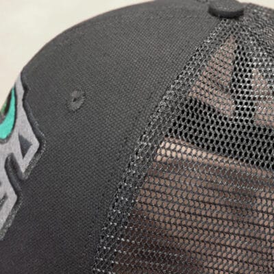Side view of black watch cap Side view of the black Schofield truckies mesh-backed watch cap