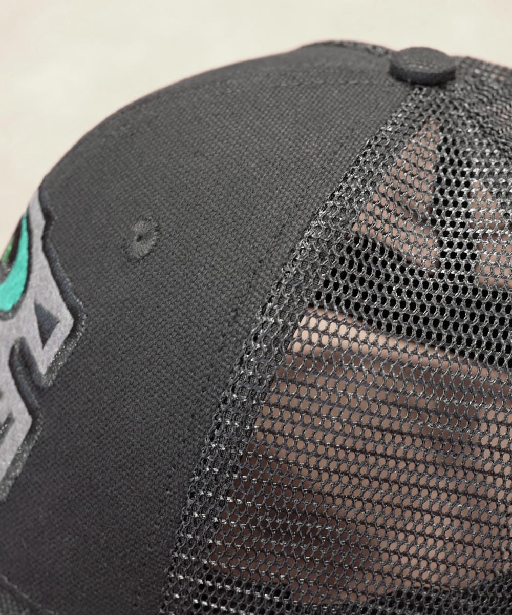 Side view of black watch cap Side view of the black Schofield truckies mesh-backed watch cap