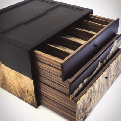 Inside the Schofield strap box with suede-lined compartments