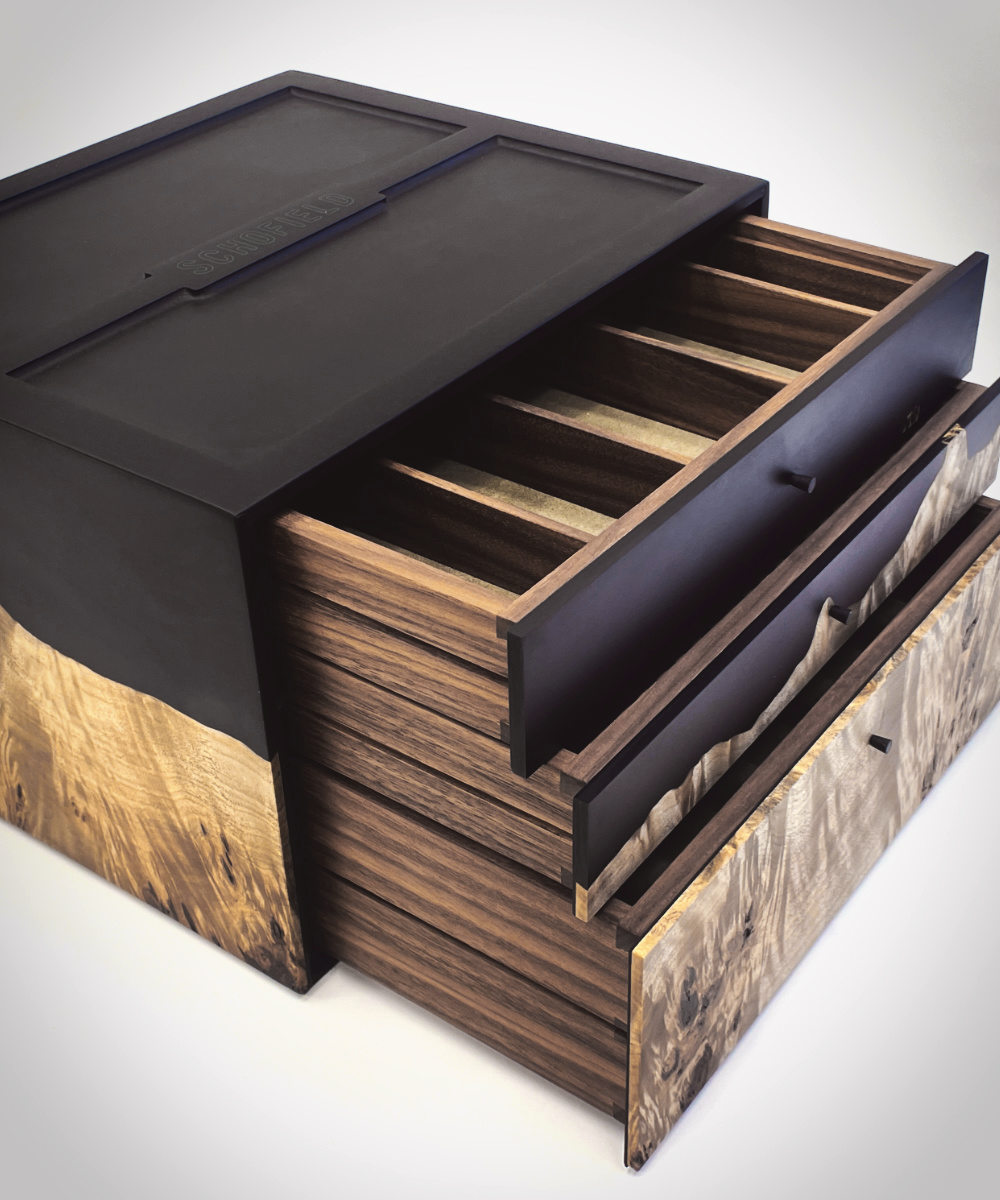 Inside the Schofield strap box with suede-lined compartments
