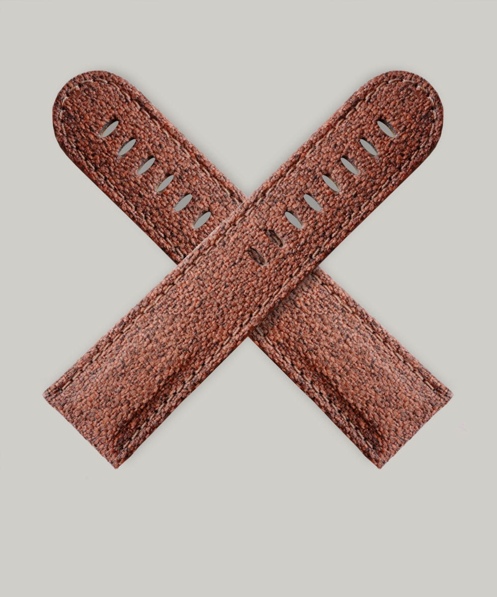 A brown watch strap that looks like a carpet bag