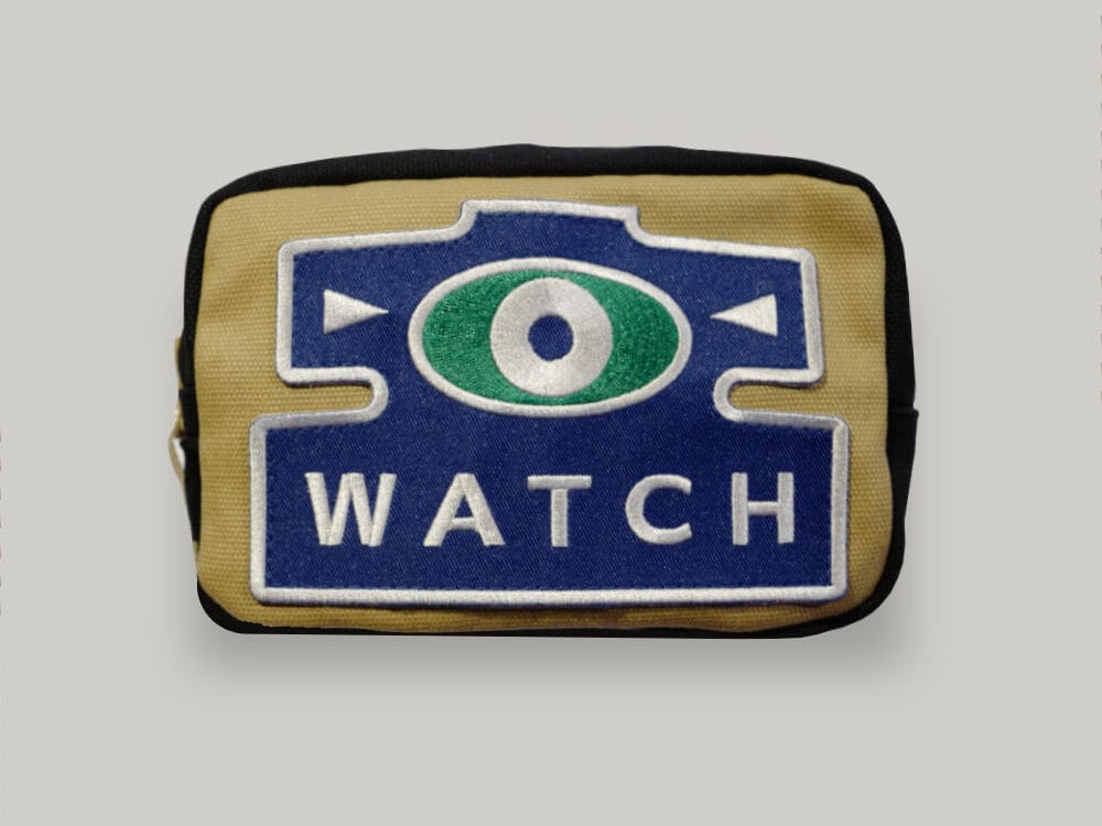 A canvas pouch for storing straps and watches, with a blue watch patch on the front
